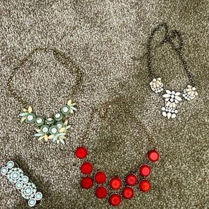 3 necklaces and 1 bracelet. Each is $5